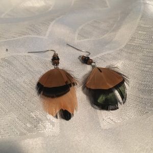 Feather earrings.